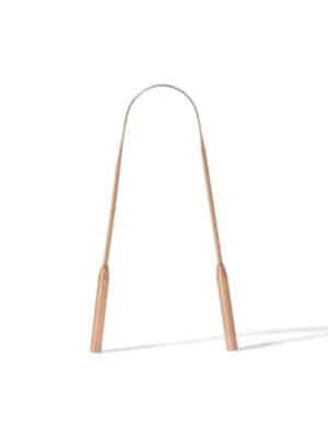 Gratte-langue en cuivre ayurvédique réutilisable pour nettoyer la langue naturellement et favoriser une bonne hygiène buccale.